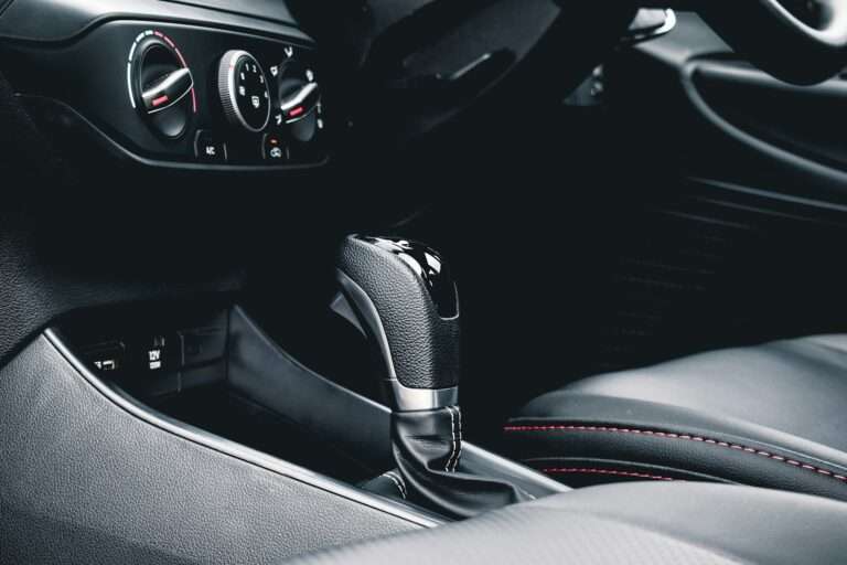 black and gray car gear shift lever